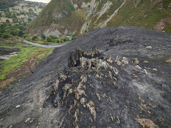 Wildfire site, landscape shot of mountains with sea on the horizon