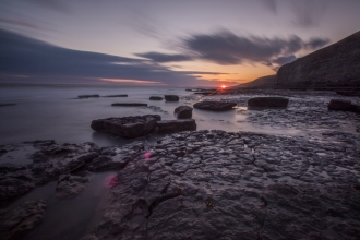 Sunset over a rocky beach _ Chris Lawrence