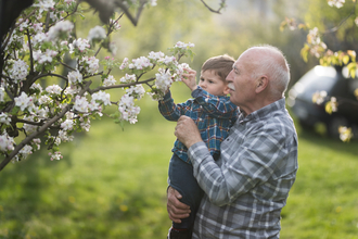 Grandfather holding his grandson