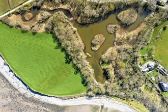 A photo of the Spinnies Aberogwen Nature Reserve from a bird eyes view, using a drone