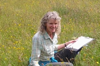 Photo of Katy Haines in a meadow