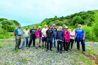 Image of volunteers with reserves officer on nature reserve