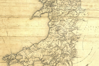 Old map of Wales showing historic roads, rivers and settlements in fine detail, with a yellowed parchment style background