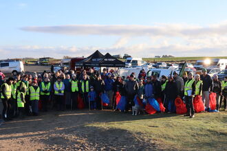 A group photo of the start of Plast Off Beach Clean 2026