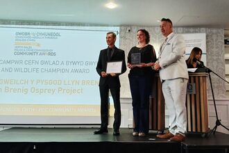 NWWT and Dwr Cymru staff on stage receiving an award.
