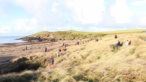 Beach cleaners at Porth Trecastell