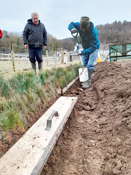 Jonny Hulson (right) learning the lining-out board planting system from Gary Bailey (left)