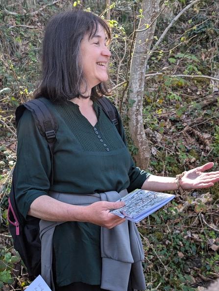 Poet Ness Owen reading a poem in the woodland at Nantporth Nature Reserve