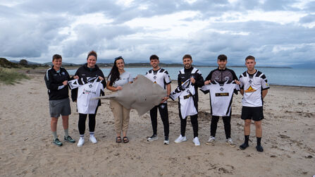 CPD Pwllheli FC and Project SIARC holding sponsored football shirt