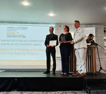 NWWT and Dwr Cymru staff on stage receiving an award.