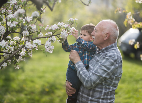 Grandfather holding his grandson