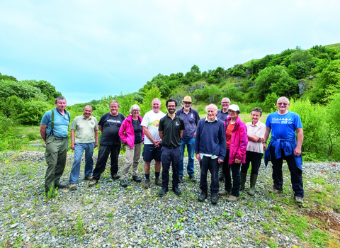 Image of volunteers with reserves officer on nature reserve